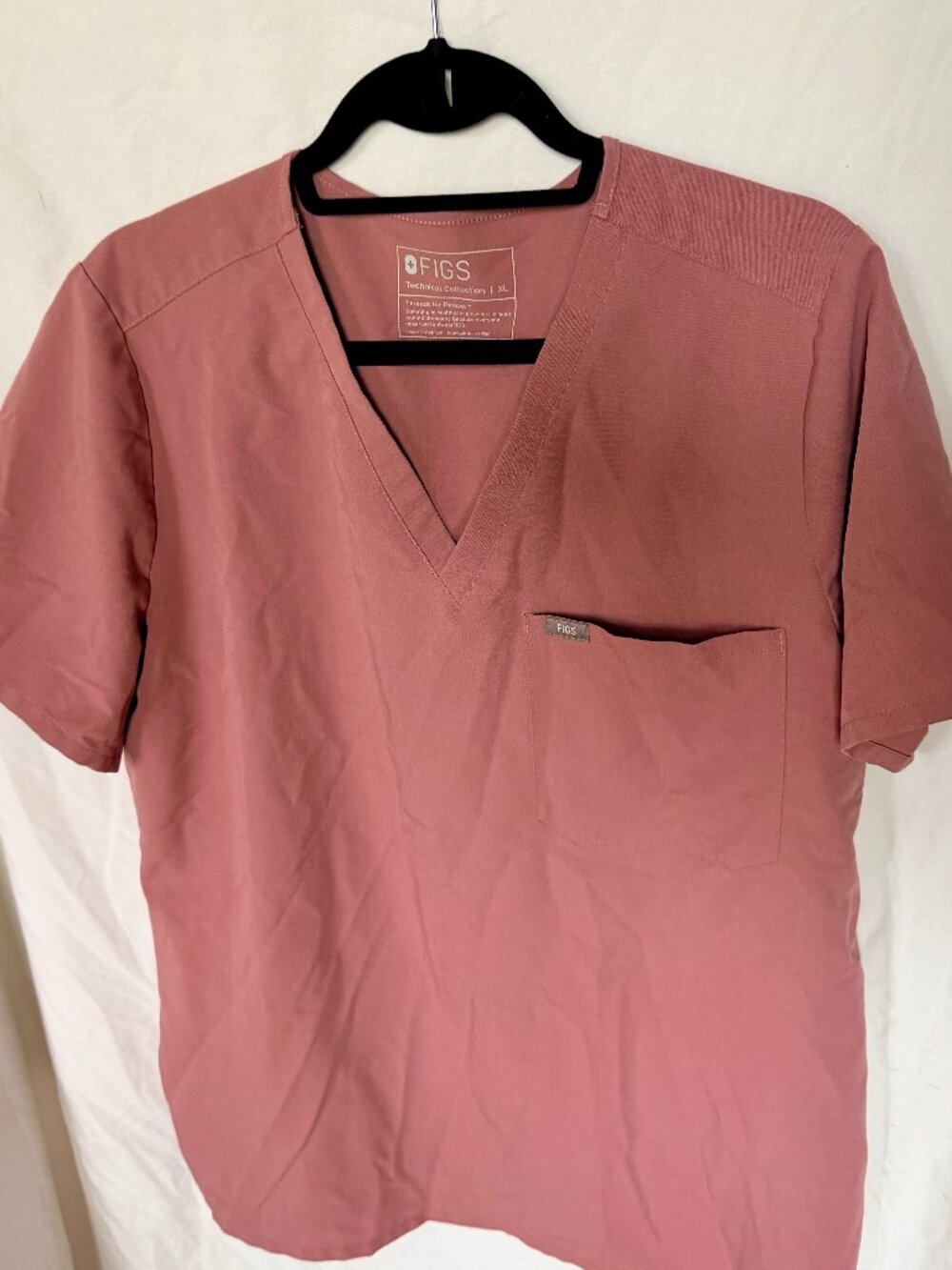 FIGS Technical Collection scrub set in a muted mauve / dusty rose pink tone